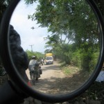 Looking back in El Salvador as my travel buddy is being warned that there are guys up ahead to rob us