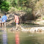 Water crossing number 2 with the village watching