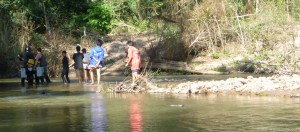 Water crossing number 2 with the village watching