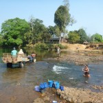 08 Tractor Cruiser Offroad Beast and Woman Bathing in River Laos