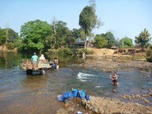 Another tractor cruisor showing us how a river crossing should be done.  Also, if you look to the right of the frame, you can see how a woman stays modest while she bathes herself in the river.